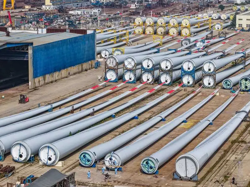 Surface Profile Uniformity in Wind Tower Section Blasting: Balancing Coating Adhesion Against Premature Fatigue Cracking 4 Automated wind tower section shot blasting process on heavy duty rollers