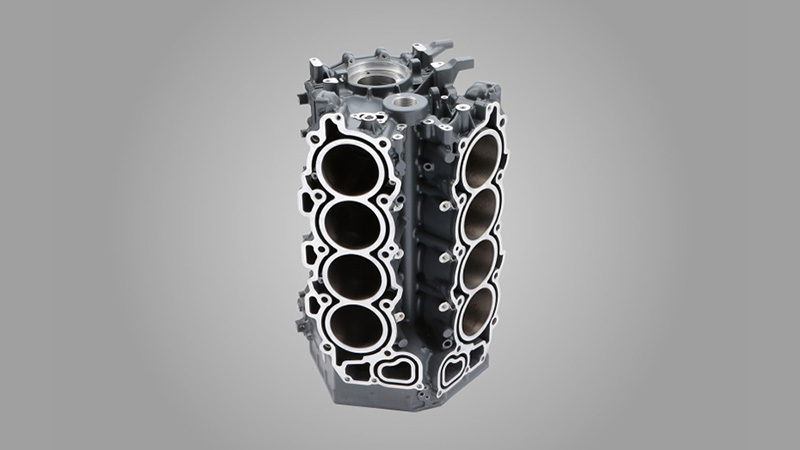 Shot blasted automotive engine block casting with clean internal water jackets and galleries.