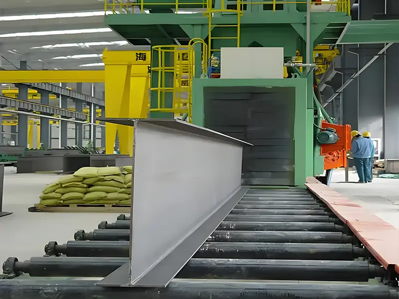 Heavy-duty H-beam roller conveyor shot blasting machine featuring multi-angle cross-firing blast wheel matrix
