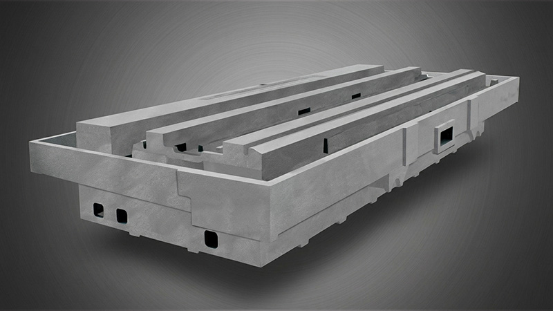Colossal heavy-scale machine tool bed casting featuring precisely hand-scraped guides and ready for precision machining.