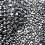 A macro technical photography showcasing the optimal shot blasting machine operating mix balance, displaying four calibrated abrasives from left to right: spherical steel shot, sharp-edged cylindrical wire cut shot, angular steel grit, and irregular crushed steel shot.