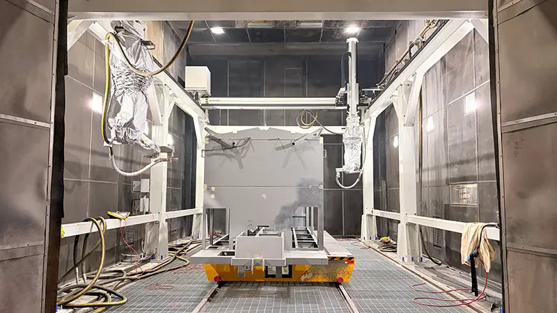 Multi-axis robotic air blasting system with automated nozzle scanning for rolling stock engineering